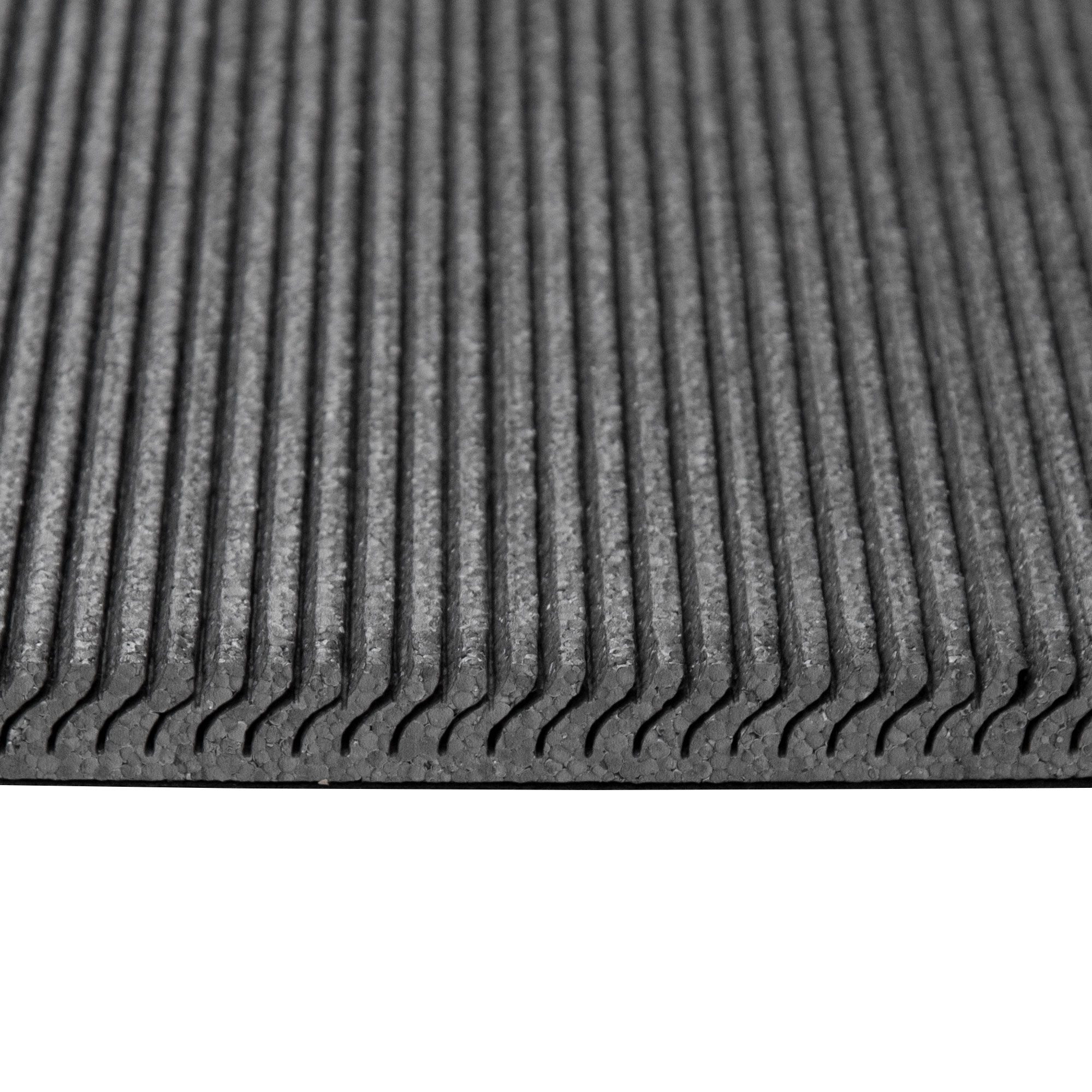 Superficie strutturata con scanalature parallele, probabilmente adatta per isolamento o imbottitura